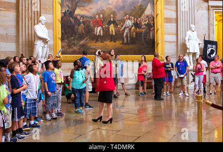 Washington, DC USA. Jun 2013. A young male intern admiring the above artwork at the nation`s Capitol rotunda area. Stock Photo